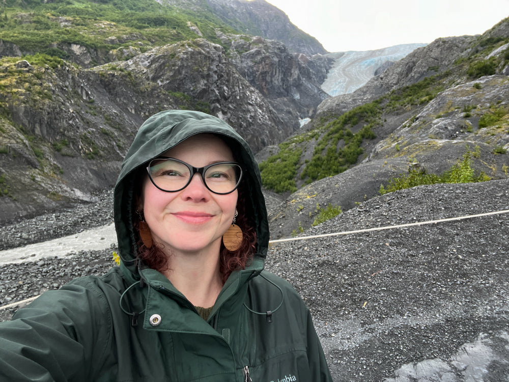 Pamela standing in front of Exit Glacier in Alaska